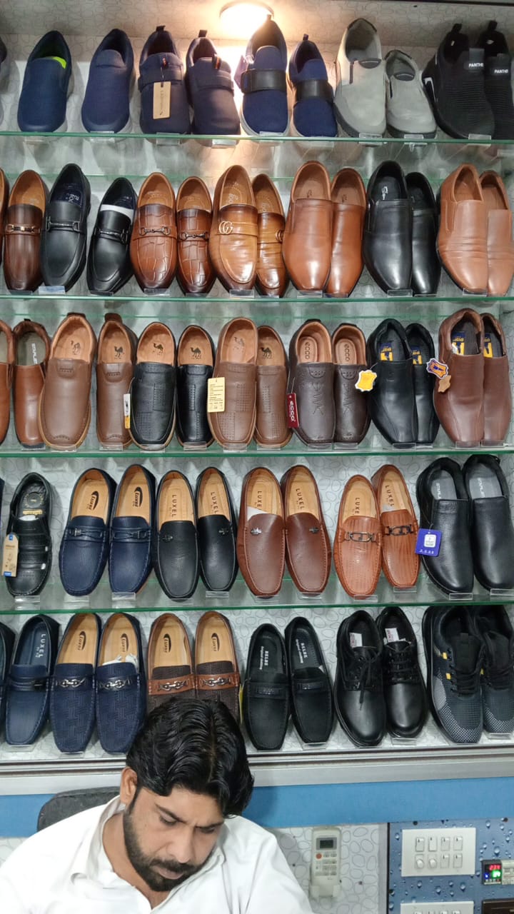 In-store dress shoes and loafers wall — Luxel, Belbe, Ecco