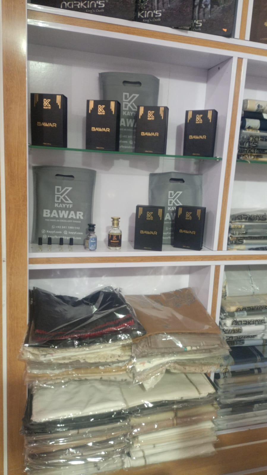 Kayyf Bawar perfume and Narkin's fabric shelf
