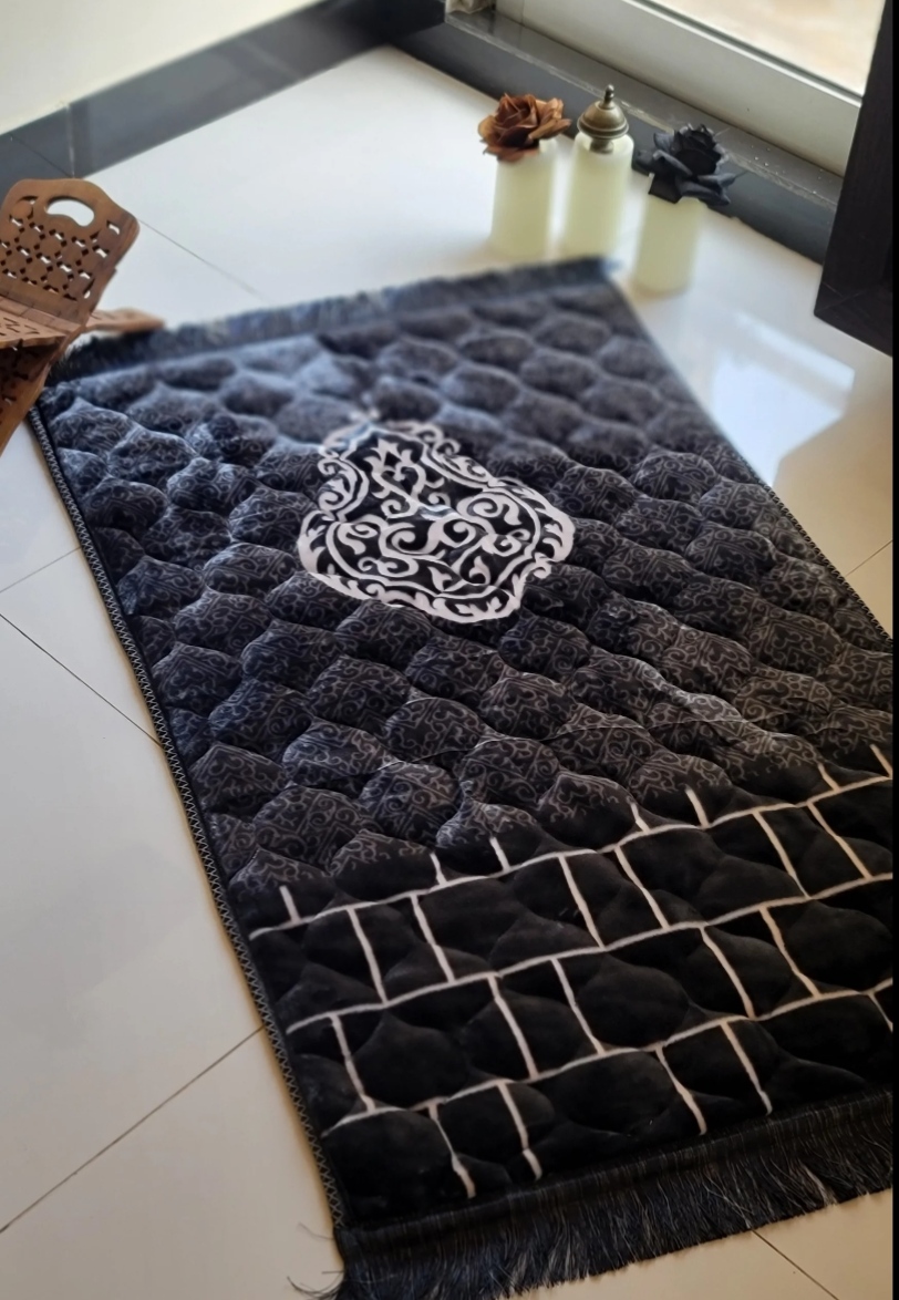 Charcoal quilted prayer mat with embroidered medallion