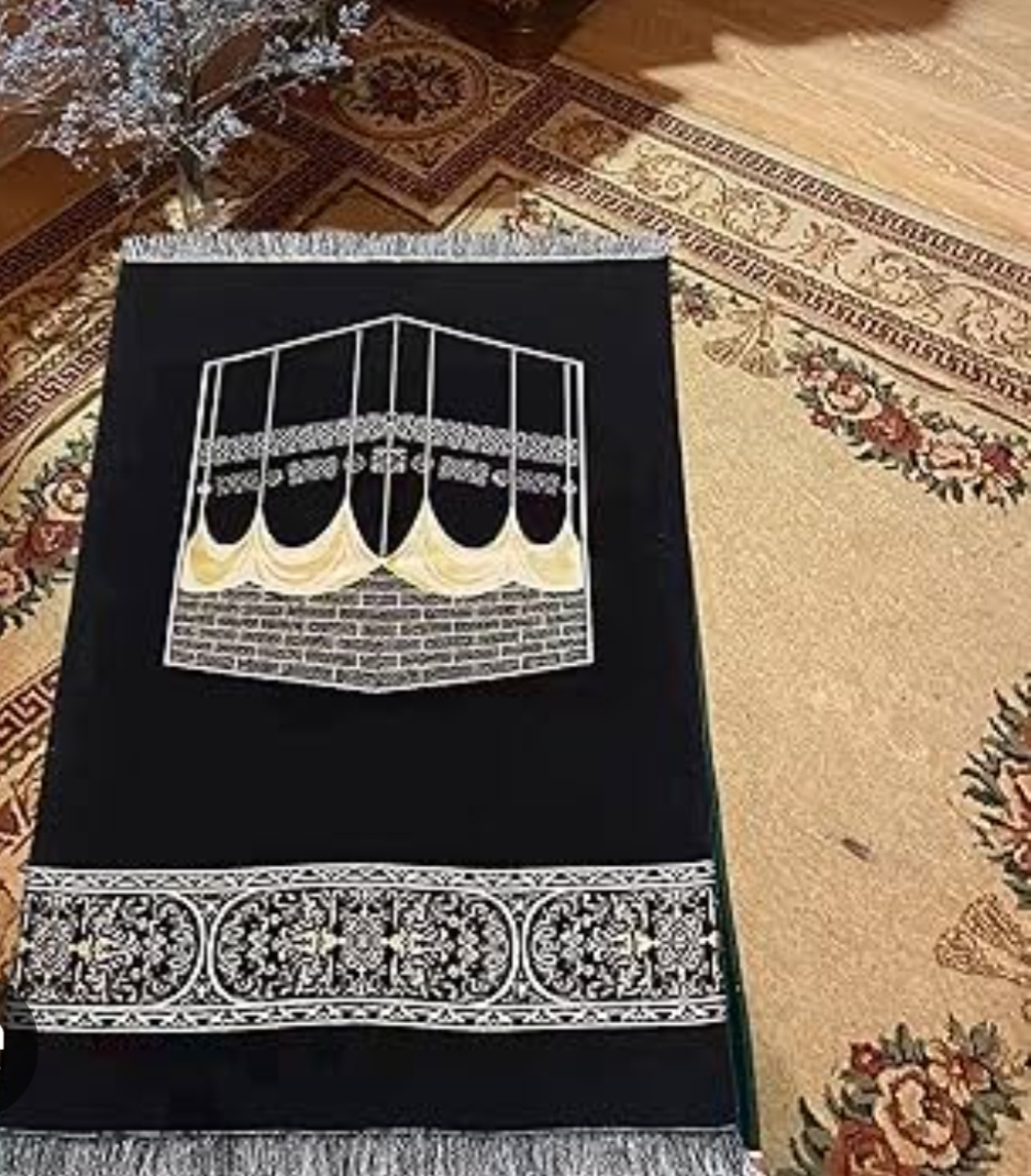 Black prayer mat with Kaaba design