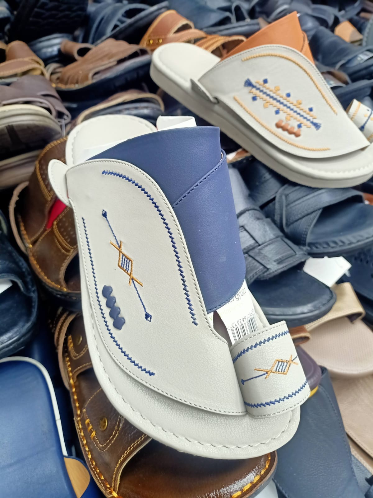 Hand-stitched cream and blue sandal